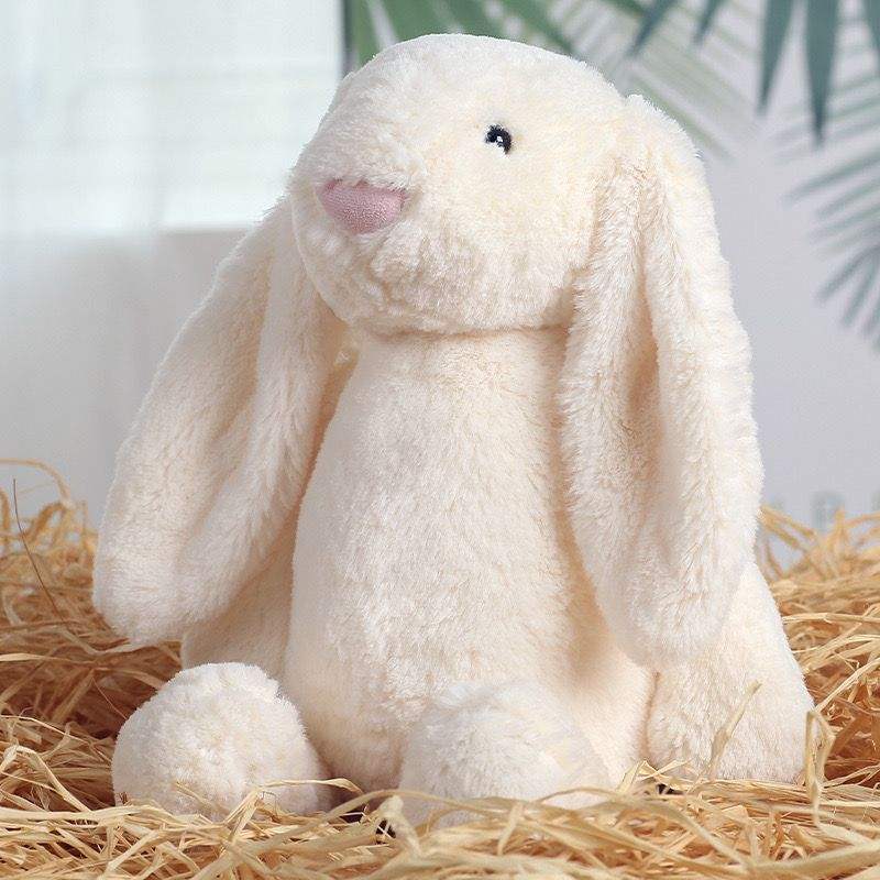 Cute white bunny plush toy with long floppy ears