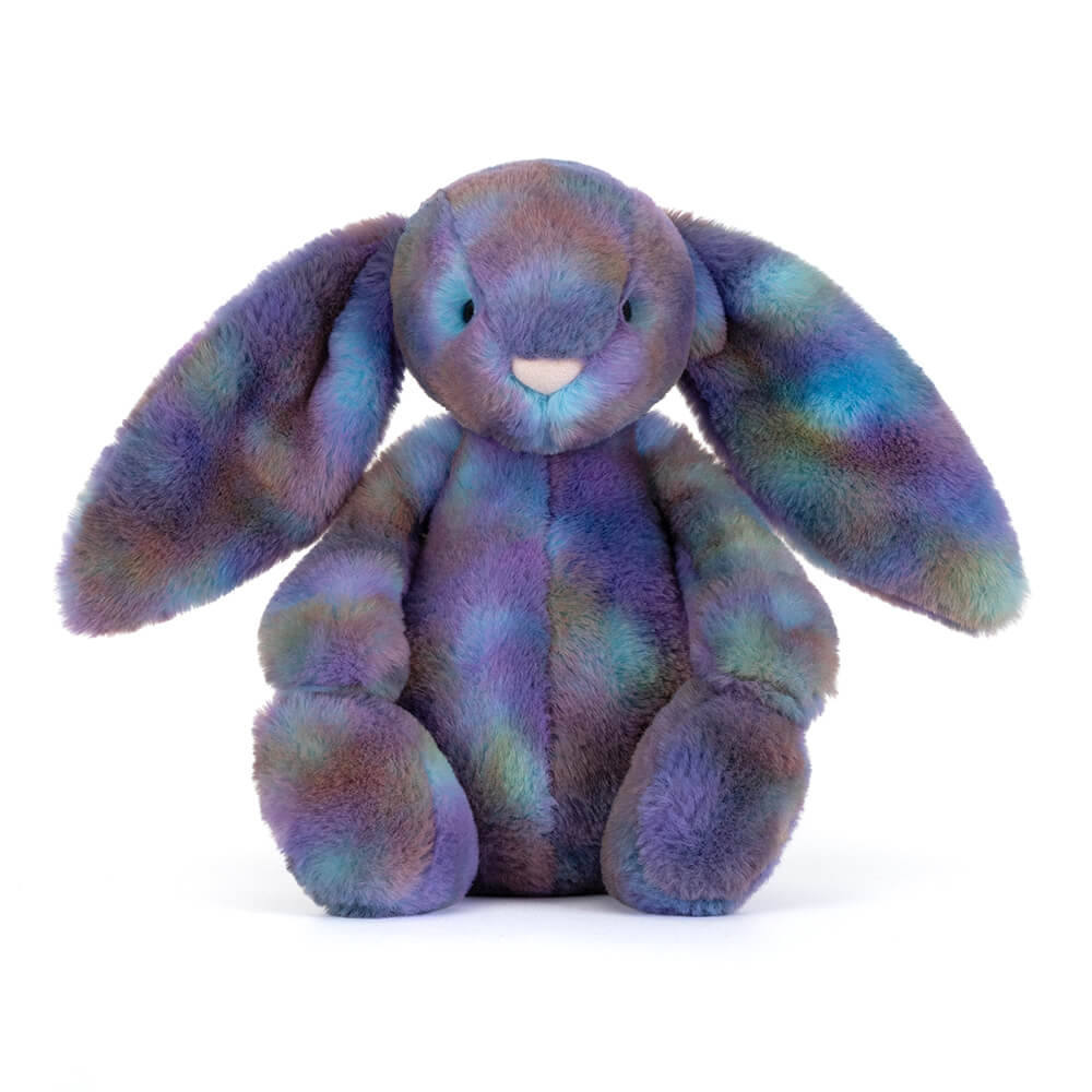 A sitting long-eared bunny plush toy with a colorful galaxy tie-dye pattern on a white background.