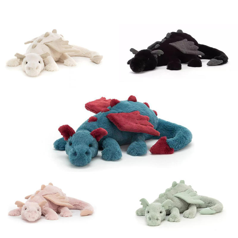 A collection of five premium dragon plush toys in white, black, teal, pink, and sage green, featuring soft wings and spines.