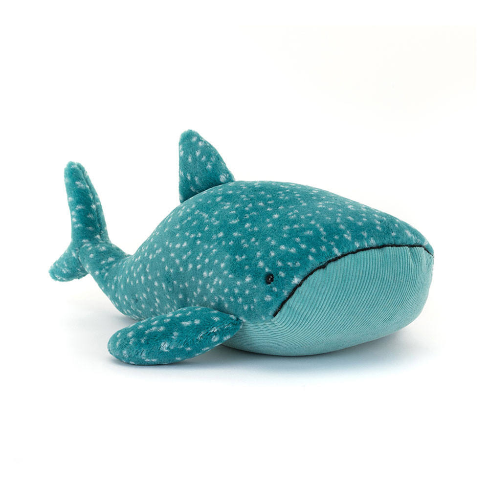 A side angle view of a speckled teal whale shark plush toy with soft fins on a white background.
