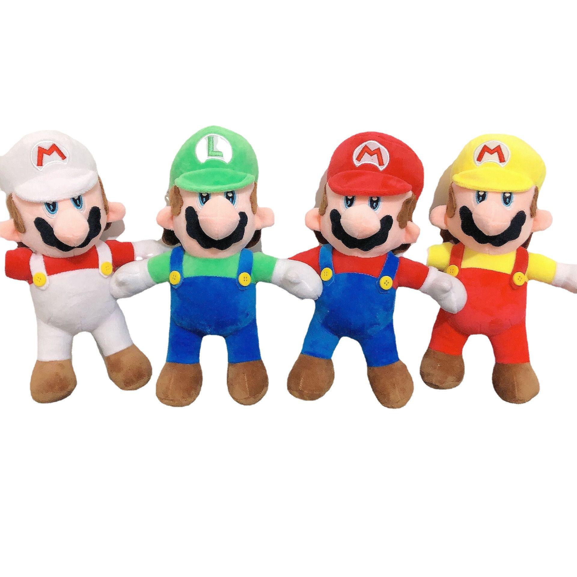 A group of four Super Mario Bros plush toys including Fire Mario, Luigi, classic Mario, and Wario color variant standing in a row.